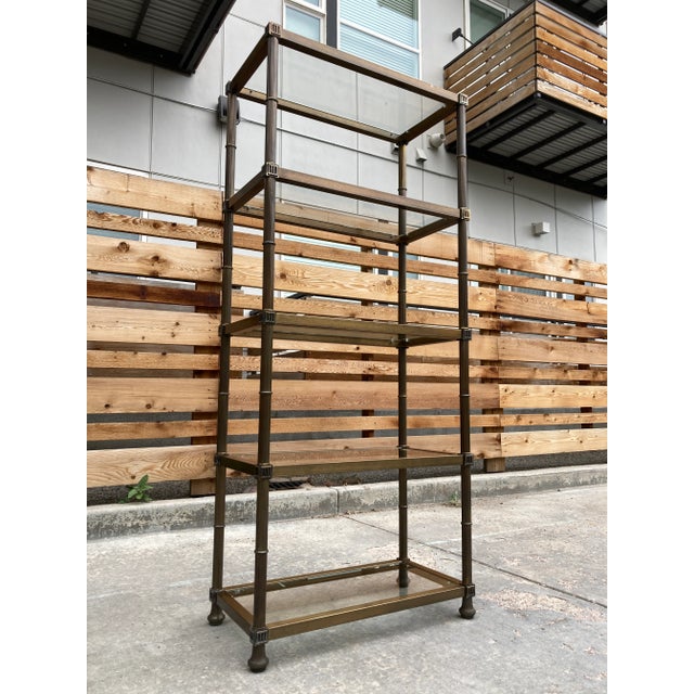 Vintage Jansen French style 5-tier glass and aged brass plated étagère, made in Italy for Mastercraft, circa mid-twentieth...