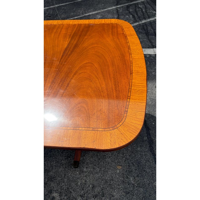 This is a gorgeous Baker Georgian style Old Charleston mahogany dining table. This extends to over 11 ft with 3 leaves....