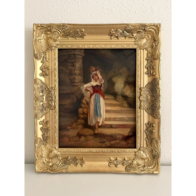 Beautiful antique oil on canvas painting depicting a young peasant woman standing beside old stone steps while balancing a...