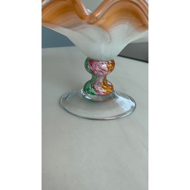 A stunning Murano blown glass bowl, combining elegance, movement, and masterful glassmaking. This piece is distinguished...