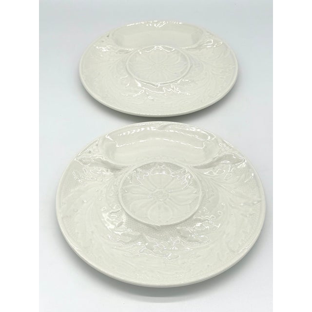 Pair of white French Gien majolica artichoke plates. Maker's mark indicates they were created between 1960 and 1971. This...