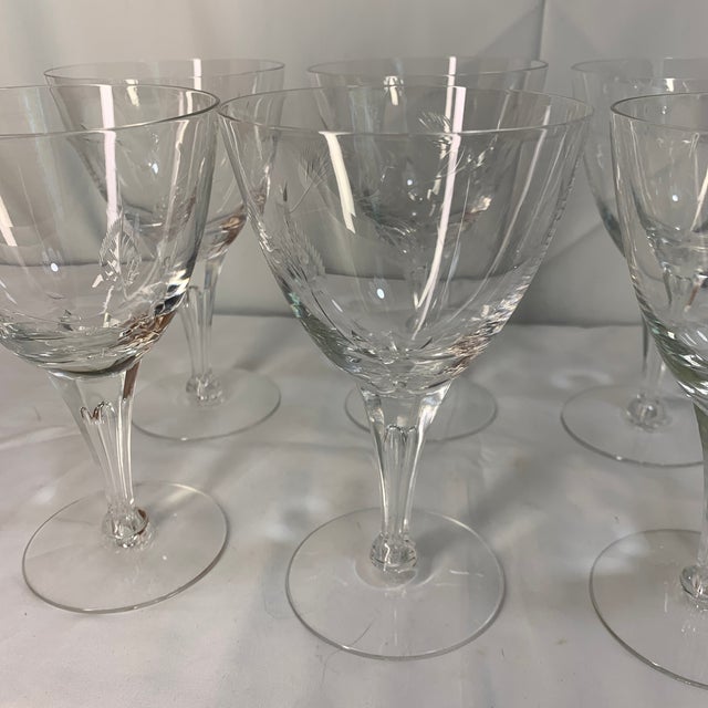 Elevate your next formal dinner or intimate gathering with this striking collection of vintage cut crystal water goblets....