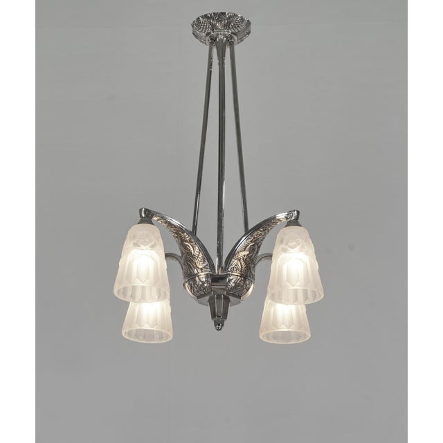 Louis Vandamme A stunning French 1930 art deco chandelier in nickel plated solid brass or bronze. The beautiful mounting...