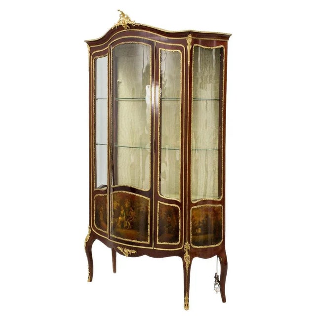 Large, three-part showcase - Gallant age, cabriole on legs. Decorated with artistic painting and elements of gilded...