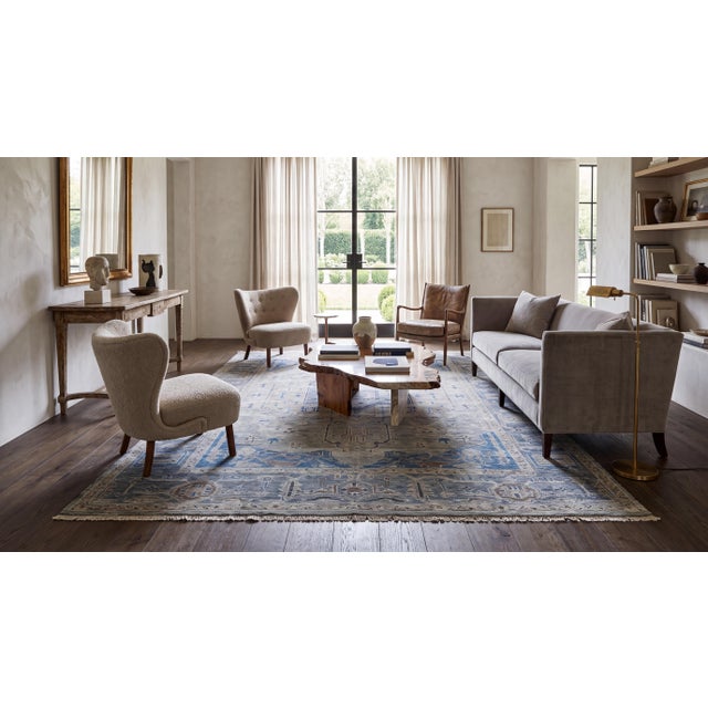 Elevate your interior with this exquisite modern hand-knotted Oushak-style area rug. Blending timeless Anatolian design...