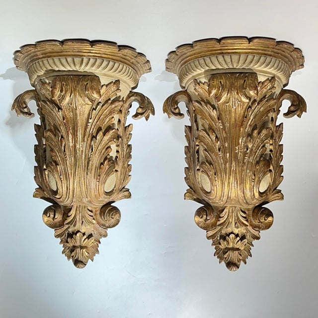 Pair of very large antique (19th century) hand-carved and gilded wooden brackets in the Baroque style measuring an...