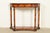 A gorgeous French Empire or Neoclassical style demilune console table In the manner of Maitland Smith USA, Circa Late 20th...
