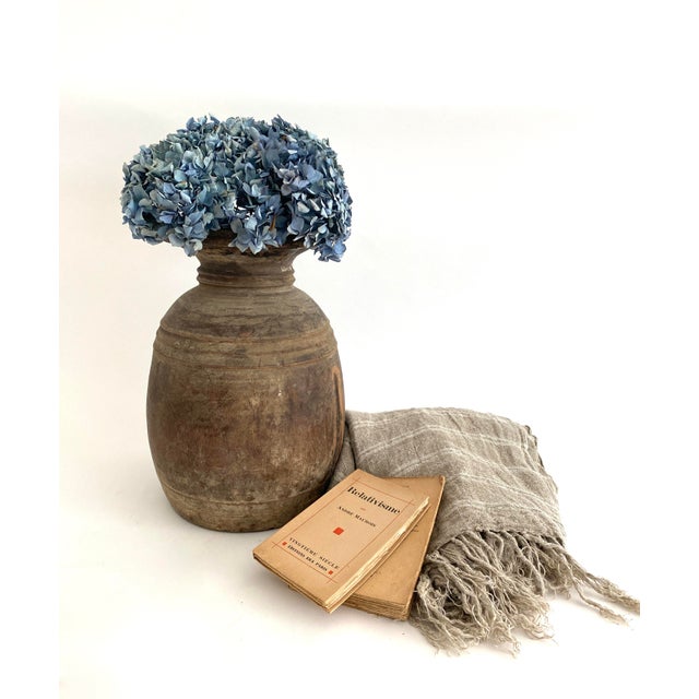 Very large rustic hand turned wood vessel which was originally used for dry food storage. Age and primitive construction...