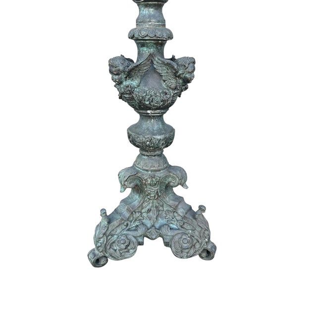 This is a antique cherub bronze floor lamp. It is in great condition.