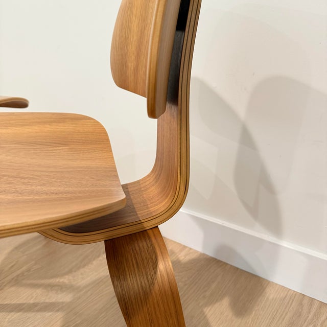 Second owner of this pair of Eames DWC chairs in a walnut finish. The chairs are in excellent condition with no chips or...