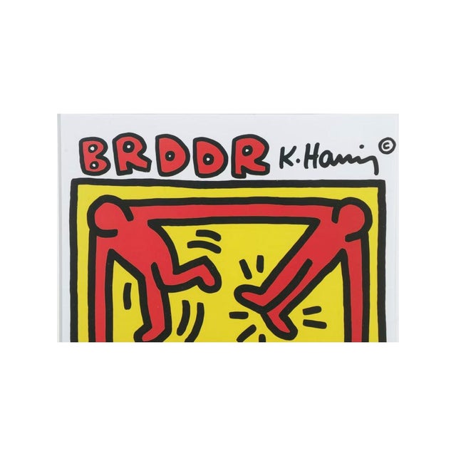 Framed pop art print featuring a graphic composition by Keith Haring, pulled from Keith Haring: Posters – Short Messages...
