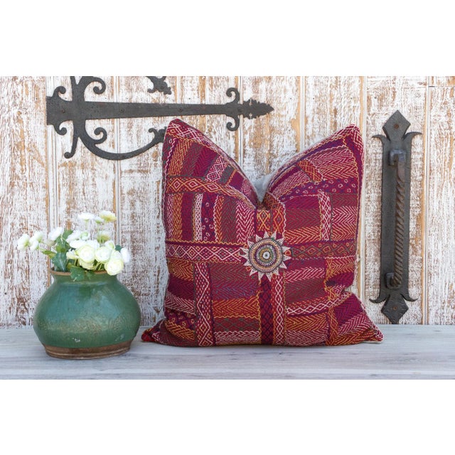 Quilted by the gypsy woman of the Saami community often reusing fabrics from clothing. This antique tribal pillow feature...
