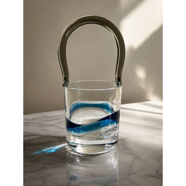 An exceptional and sophisticated vintage ice bucket (or decorative basket) crafted from fine hand-blown Murano glass. This...