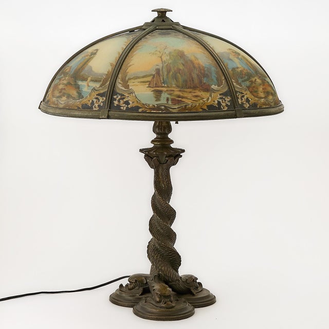 This exceptional Bradley & Hubbard reverse-painted glass and patinated metal table lamp was crafted during the first...