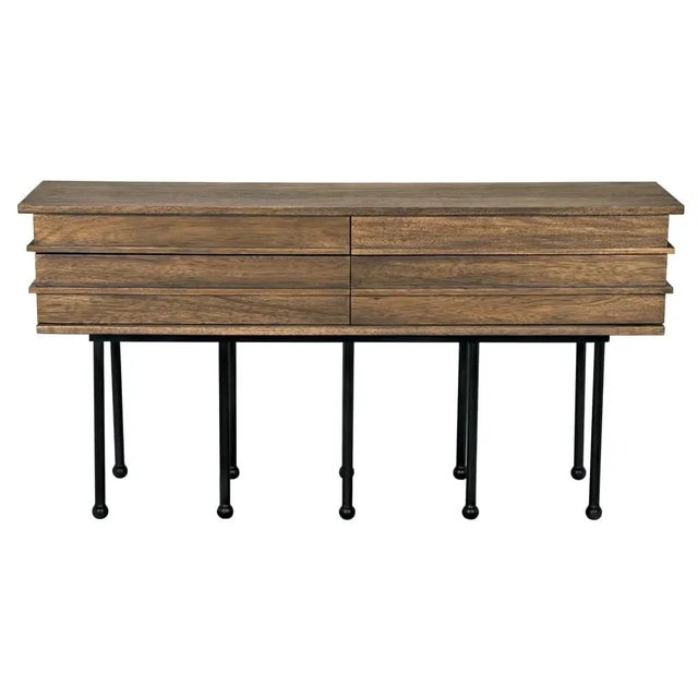 The Oliver Console is a testament to craftsmanship, featuring Walnut, Industrial Steel, and Veneer, finished in a...