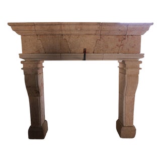 20th Century French Limestone Fireplace with Tapered Jambs and Stepped Cornice For Sale