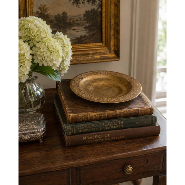 An elegant early 20th-century bronze doré shallow bowl or plate by Tiffany Studios, New York, distinguished by its richly...