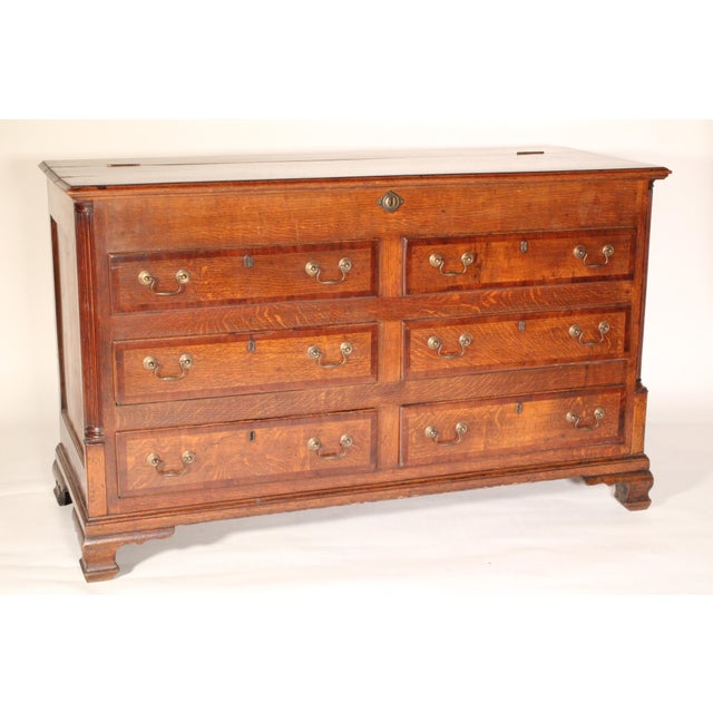 Antique George III style oak mule chest, late 19th century. With a hinged top with mahogany crossbanded front and side...