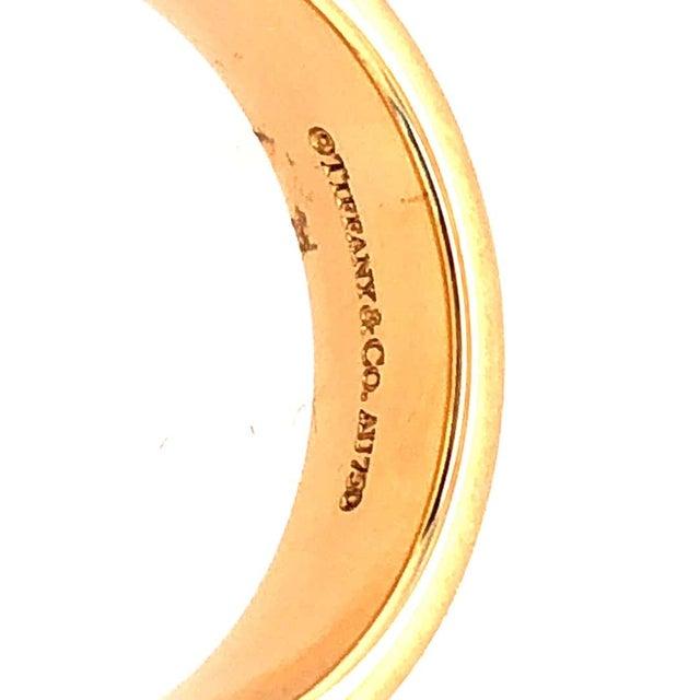 Tiffany & Co. 18Kt Yellow Gold Wedding Ring/Band. Stamped AU750 Size 9 with 11 grams total weight.