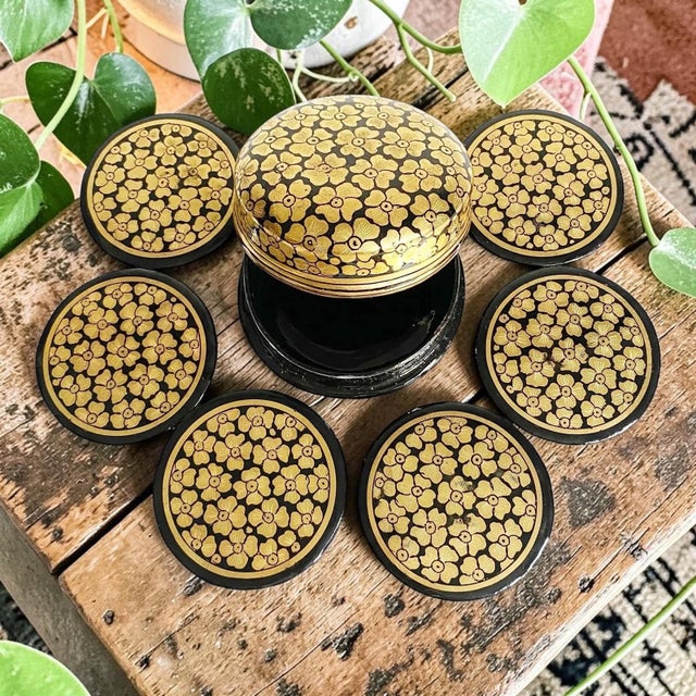 Elevate your home decor with our Hand Painted Paper Mache Trinket Box, beautifully adorned with a striking black and gold...