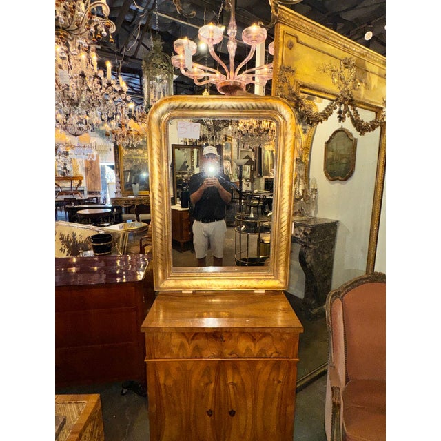 The French Louis Philippe Giltwood Mirror is a luxurious and elegant addition to any home décor. Made with intricate...