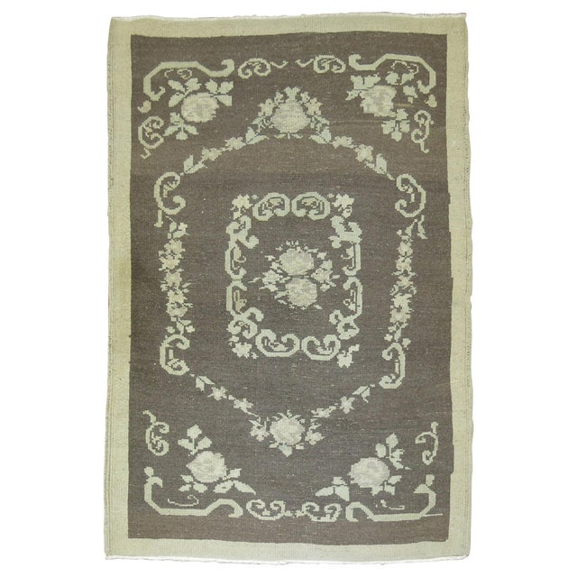 Mid-20th century Turkish rug with a floral design with gray and cream accents. Measures: 3'4" x 4'6", circa mid-20th century.