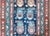 A stunning early 20th century Persian Ganjeh runner with an all-over repeated paisley pattern surrounded by a wide border...