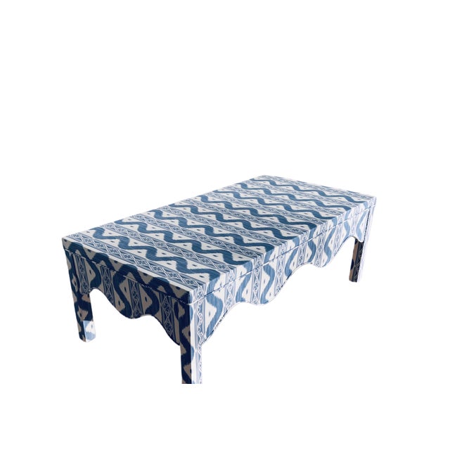Custom scalloped coffee table in navy blue/white Ikat. The fabric pattern is most definitely a dark blue on white...