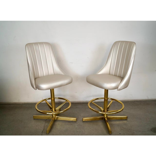 Pair of vintage Mid century Modern counter stools for sale. They were manufactured by Chromcraft, and were made here in...