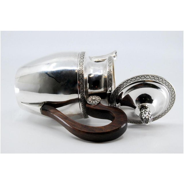 Silver Teapot with Engraved Plant Motifs, in Very Good conditions. Designed before 1890 This piece has an attribution...