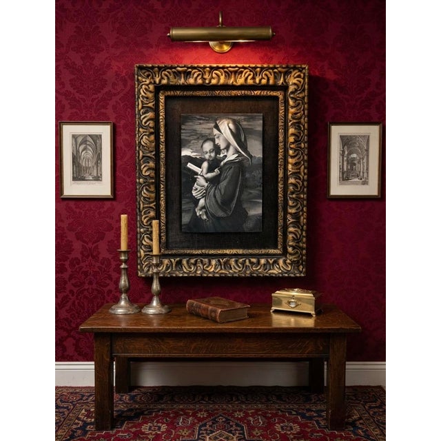 This striking devotional art piece features a highly detailed, textured engraving after Raphael’s famous High Renaissance...