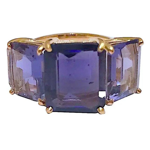 Christina Addison This Bold 18kt Yellow Gold Emerald Cut Three Stone Ring with Three Iolite is a fantastic every day ring....