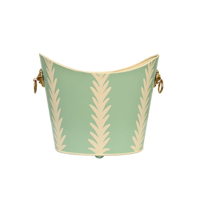 New item. Not vintage. Be the king (or queen) of tidiness with this small oval wastebasket! The raised ends and lion...