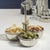 A sleek and sophisticated serving solution, this Basso Condiment Trio features three integrated condiment dishes crafted...