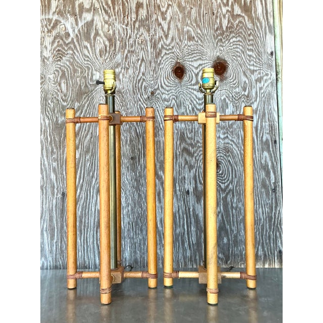 Elevate your space with this stunning pair of vintage boho rattan lamps, featuring a sculptural open-frame design that...
