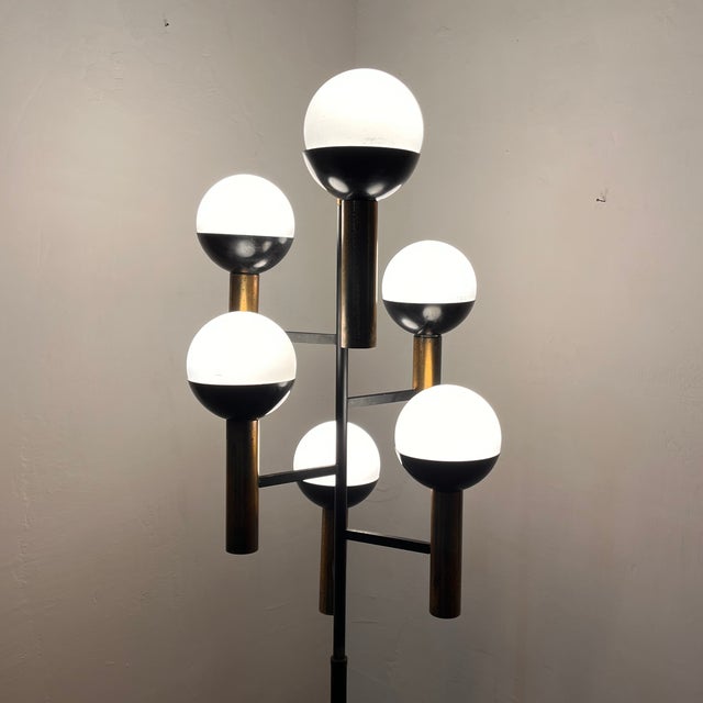 An extraordinary and rare six-light floor lamp made by Stilnovo in the 1950s, a perfect emblem of the avant-garde lighting...