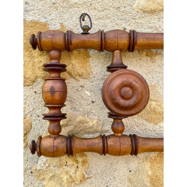 Large, vintage, french, wall-mount coat/hat rack with 3 pegs, circa 1890's. piece is is made of beechwood, and showcases a...