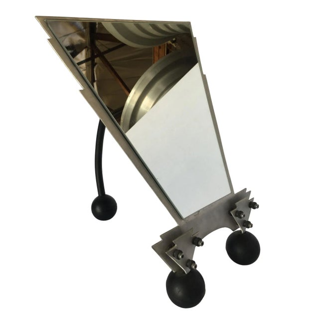 Custom hand made Memphis style featuring a machined steel tabletop vanity mirror with enameled metal leg along the back.