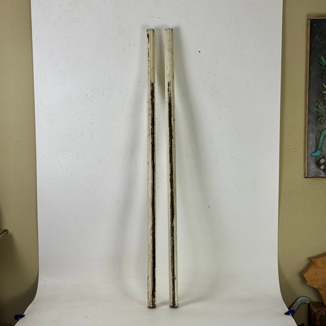 A lovely pair of cylindrical architectural salvage slender wooden columns. They are in a fluted design, with vertical...