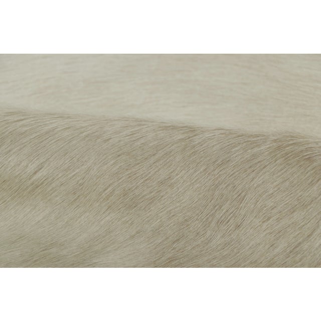 This 7x8 contemporary cowhide rug is an exciting new addition to Rug & Kilim’s Modern collection—a naturally shaped animal...