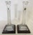 Pretty pair of tall Waterford Crystal candlesticks on wood plinths. These are like new with no wax residue. Each maintains...