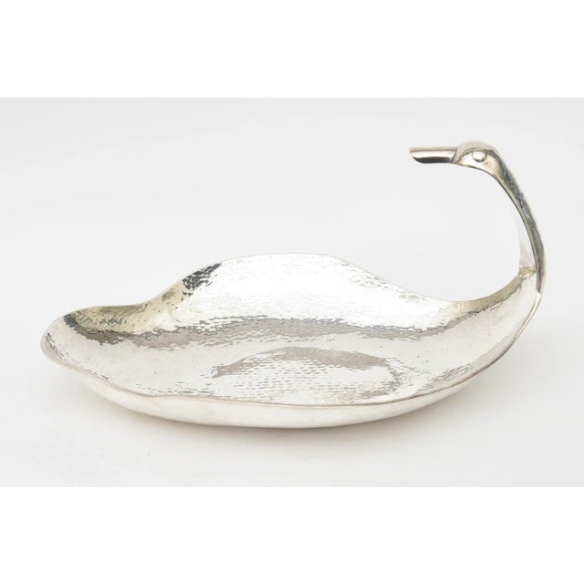 This fabulous vintage hand hammered silver plate serving bowl has an elongated neck of a duck form with a large beak. This...
