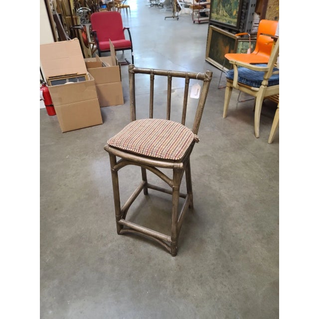Set of 8 dark Stained rattan bar stools with woven wicker seats and 3-strand rattan pull legs. The stools come with a...