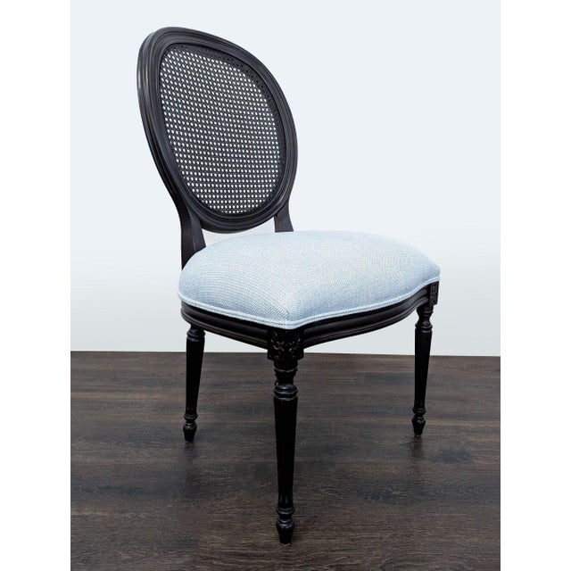 French-inspired chair with a cane balloon back and upholstered seat. Brand: Ethan Allen. Original Price: $1072. Dimensions...