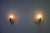 Pair of mid-century brass and glass wall lamps by stilnovo, italy, 1960s. This elegant set features softly curved opaline...