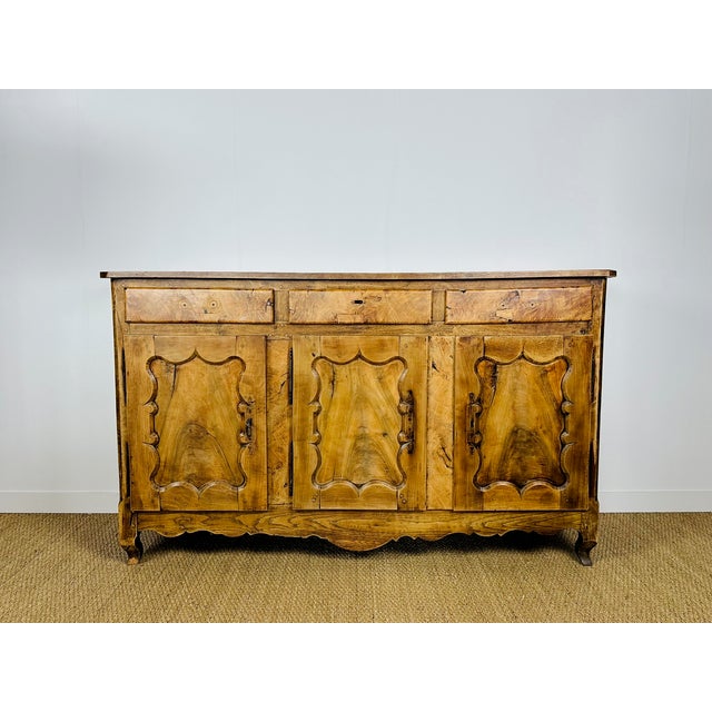 A very beautiful antique solid wood buffet with three doors and three drawers, dating from the 19th century, in the pure...