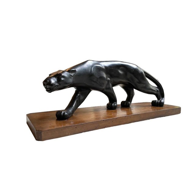 Striding panther Art Déco terracotta France around 1930. Terracotta with black patina mounted on a wooden base. Height: 19...