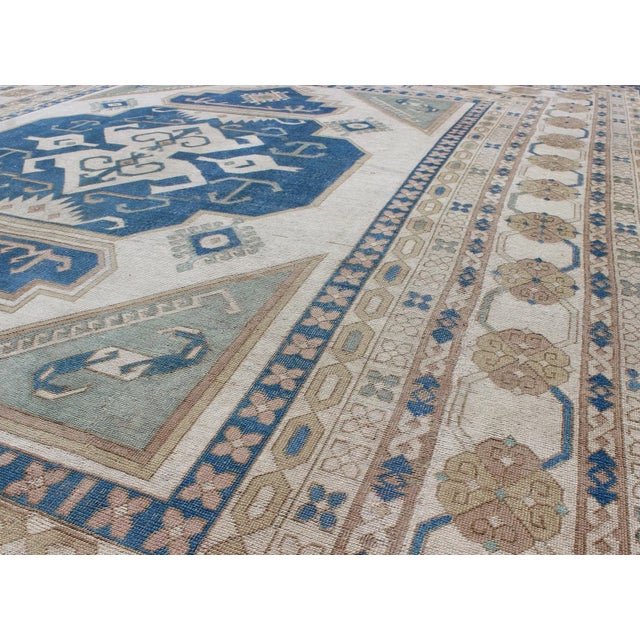 Tribal Large Vintage Turkish Rug With Stylized Geometric Design in Blue, Ivory, Tan For Sale - Image 3 of 12