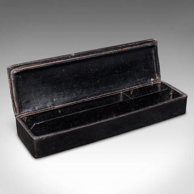 This is an antique calligrapher's pen box. An Oriental, lacquered papier-mâché quill case in Chinoiserie taste, dating to...