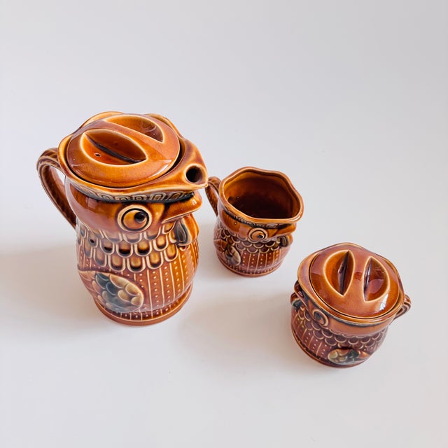 A mid century pottery tea set, made in Japan. Wonderful chicken design to each piece with orange-brown and green glazes....
